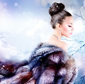 stock photo of animals  - Winter Girl in Luxury Fur Coat - JPG 