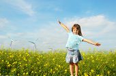 picture of future technology  - Little girl in front of windmills - JPG 