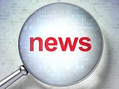 picture of newsprint  - Magnifying optical glass with words News on digital background - JPG 