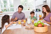 stock photo of food  - Family eating healthy breakfast in kitchen - JPG 