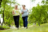 picture of outdoor  - Portrait of two senior females running outdoors - JPG 