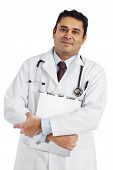 stock photo of medical doctors  - Photo of a Indian doctor in his late thirties smiling and holding a medical file - JPG 