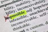 image of possibility  - The word possible highligted from impossible in a dictionary - JPG 