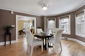stock photo of interior  - Dining room in suburban home with wall of windows - JPG 