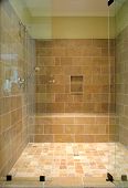 pic of opulence  - huge stone shower with glass door niche and bench - JPG 