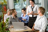 image of order  - Waitress taking order from businessmen in cafe smiling laptop work - JPG 