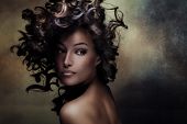 stock photo of exotic  - beautiful black young woman beauty shot with hair in motion - JPG 