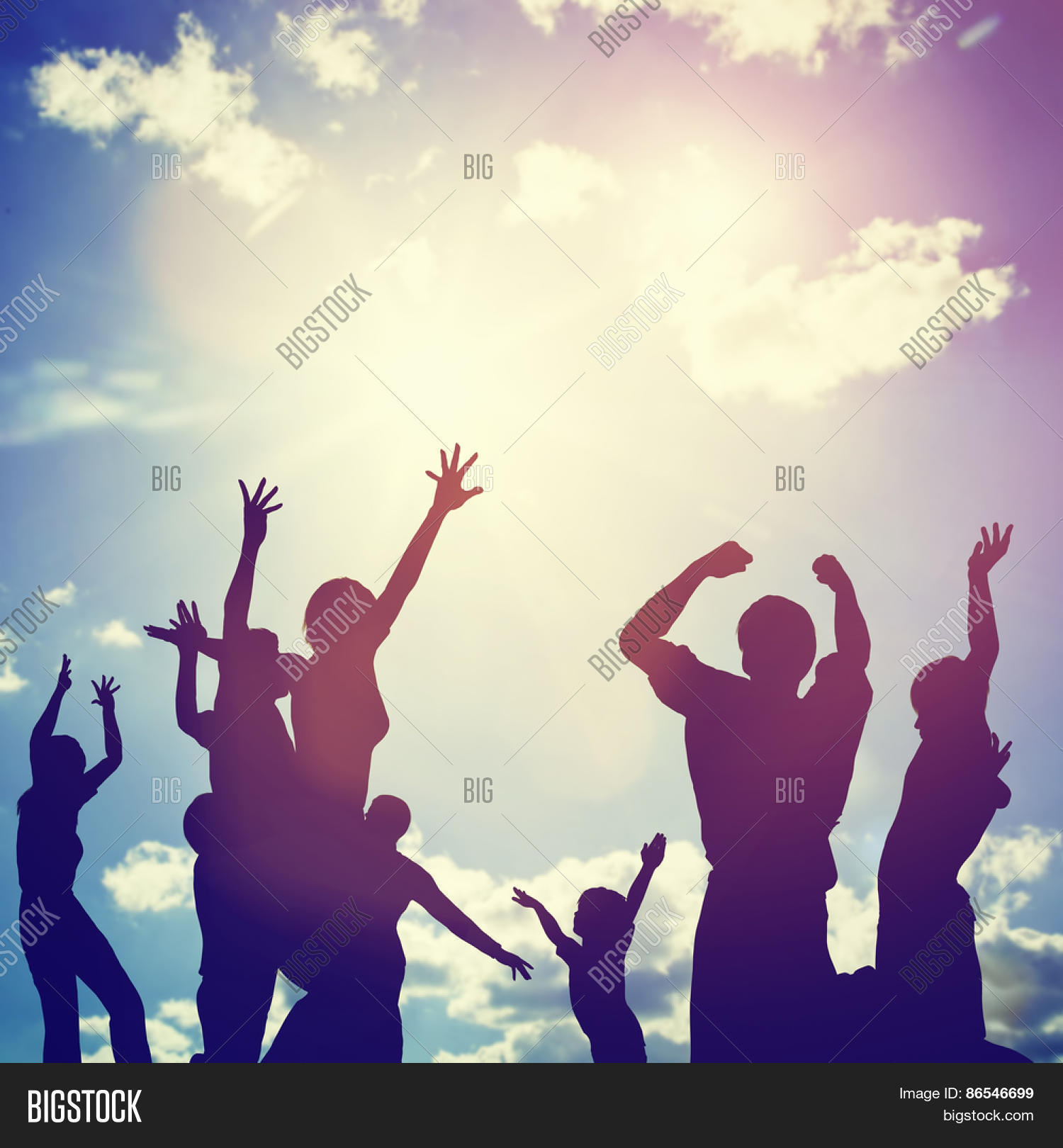 happy friends, family jumping together in a circle having fun