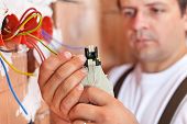 stock photo of wire  - Electrician installing electric wires in a new building  - JPG 