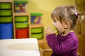 stock photo of food  - Happy children and healthy food baby girl eating fruit at school - JPG 