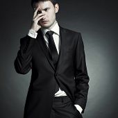 foto of business people  - Portrait of handsome stylish man in elegant black suit - JPG 