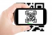 picture of scan  - Smartphone in hand scanning code - JPG 
