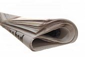 picture of newspaper  - Rolled up newspaper on a white backgammon
 - JPG 