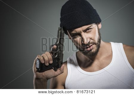 Poster: Handsome Criminal Holding A Gun