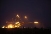 picture of industrial  - bucket wheel excavator digging for brown coal night view Poland extractive industry
 - JPG 
