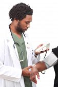 stock photo of bloodpressure  - Doctor measuring blood pressure - JPG 