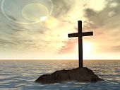 picture of religion  - Concept or conceptual dark christian cross standing on a rock in the sea or ocean over a beautiful sky at sunset as a metaphor for faith - JPG 