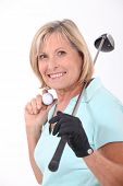 picture of golfer  - Mature female golfer - JPG 
