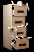 stock photo of idiom  - Skeletons in a cabinet are partially revealed in this low key image - JPG 