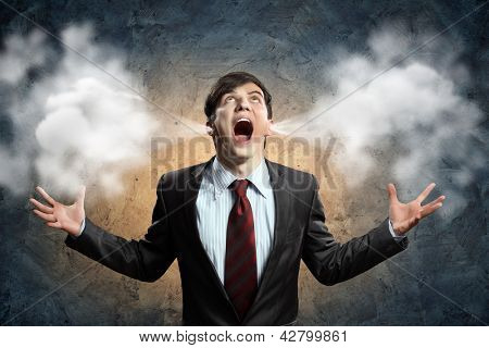 Picture or Photo of Businessman in anger screaming puff going out from ears