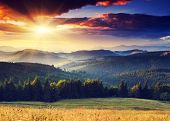 stock photo of holidays  - Majestic sunset in the mountains landscape - JPG 