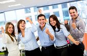stock photo of group  - Successful business group with arms up at the office - JPG 