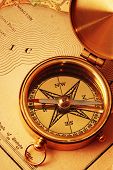 picture of longitude  - Antique brass compass over old USA map background - JPG 