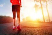 foto of fitness  - Athlete runner feet running on road closeup on shoe - JPG 