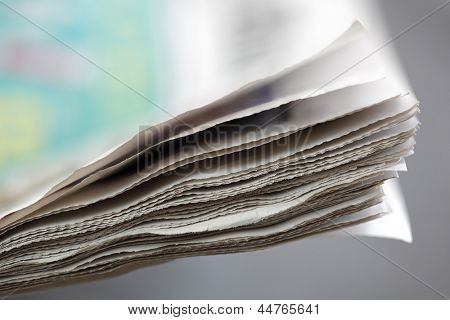 Picture or Photo of Newspaper concept edge of newspaper pages with shallow depth of field