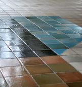 stock photo of floors  - ceramic tile floor with interesting pattern fading into the distance - JPG 