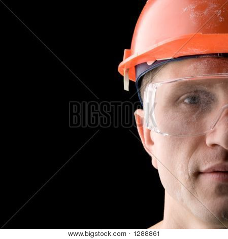 Picture or Photo of Construction worker covered with dust isolated on black