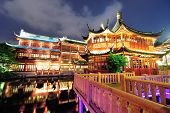 stock photo of buildings  - Historical pagoda stile building in Shanghai at night - JPG 