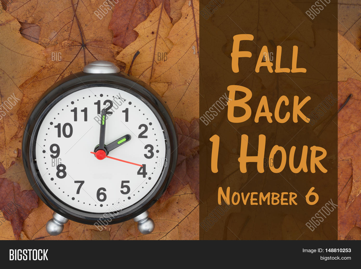 Daylight Savings Time message Some fall leaves and retro alarm clock
