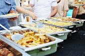 picture of business people  - people choosing food from table on catering and buffet party on business seminar conference or wedding - JPG 