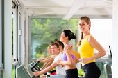 pic of fitness  - Running on treadmill in gym or fitness club  - JPG 