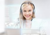image of helpline  - futuristic female helpline operator with headphones and virtual screen - JPG 