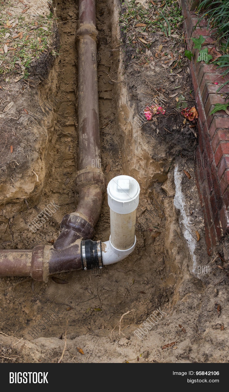 PVC Sewer Line Clean Out Installed On Old Ceramic Clay Sewer Line Pipe