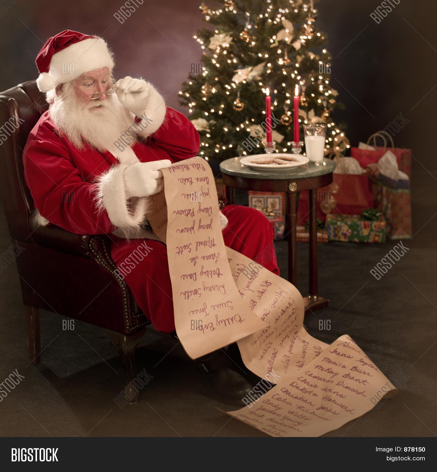 santa reading christmas wish list image photo bigstock santa reading christmas wish list image photo bigstock