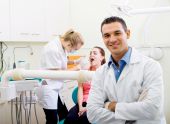 foto of watch  - Young confident male dentist in dental practice - JPG 