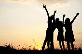 foto of sunset  - Little girls on meadow at sunset - JPG 