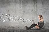 stock photo of headphones  - Sitting blonde girl using a laptop computer from which coming out many images and listening to the music with a pair of headphones - JPG 