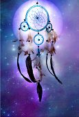 picture of religion  - a magic dreamcatcher over cosmic background with stars and a planet - JPG 