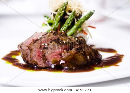 Picture or Photo of A gourmet fillet mignon steak at five star restaurant.