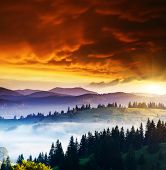 stock photo of sunset  - Majestic sunset in the mountains landscape - JPG 