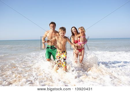 Picture or Photo of Young family play on beach