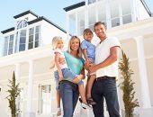 picture of home  - Young Family Standing Outside Dream Home - JPG 