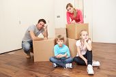 stock photo of family  - Young family looking upset among boxes - JPG 