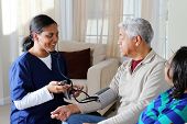 pic of health  - Home health care worker and an elderly couple - JPG 