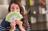 picture of currency  - Happy Woman Holding Euro Currency - JPG 