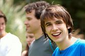picture of teenager  - Portrait young happy teenage boy at the park with friends - JPG 